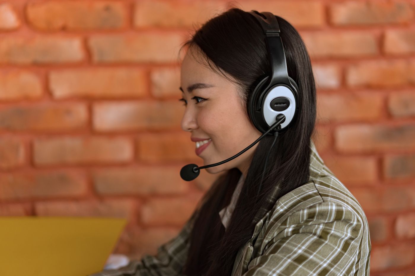 A person speaking into a headset microphone