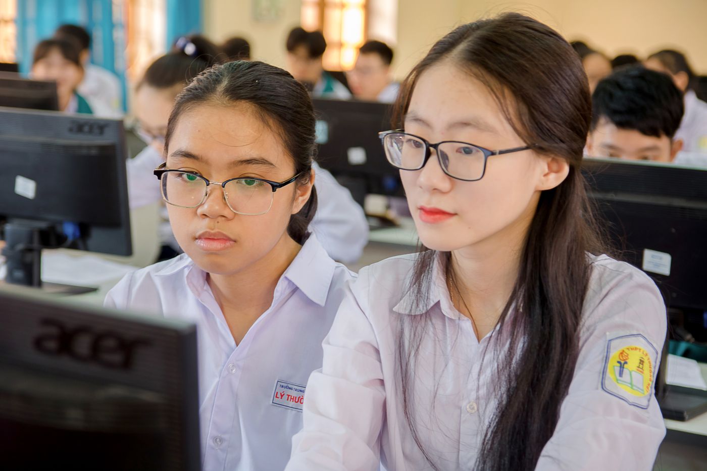 Two students working at a computer